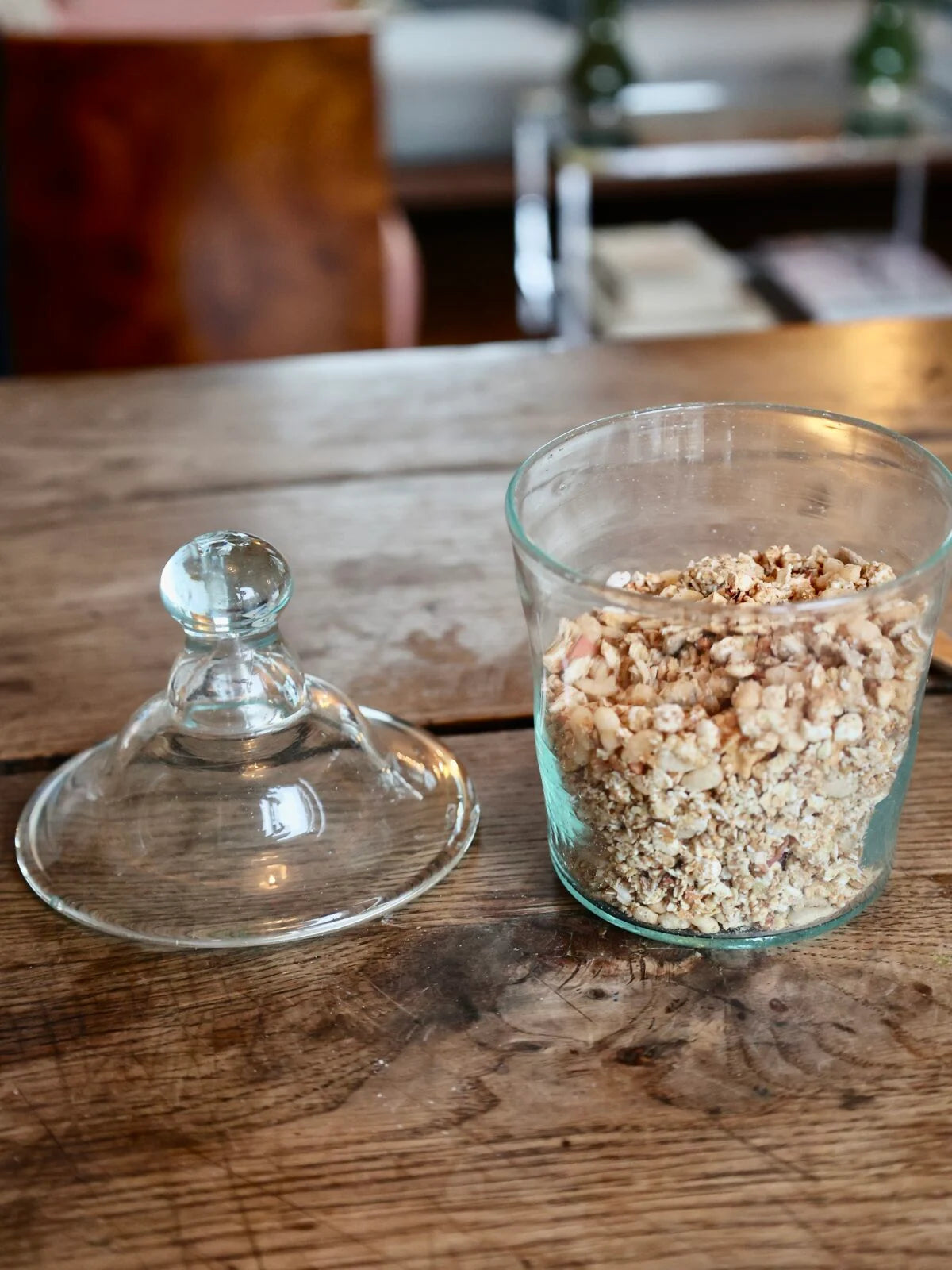 Handmade clear glass jar with lid on a wooden surface