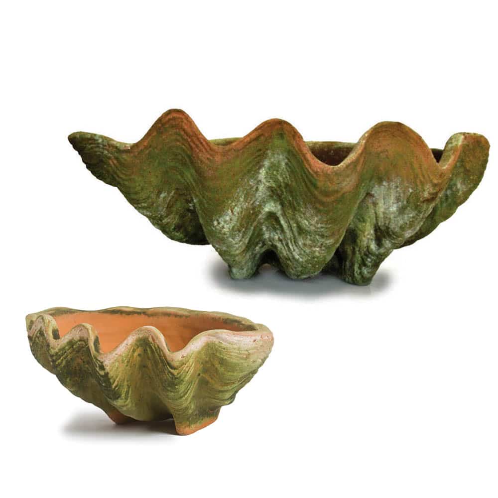Two ceramic shell-shaped planters in green and terracotta tones, on a white background