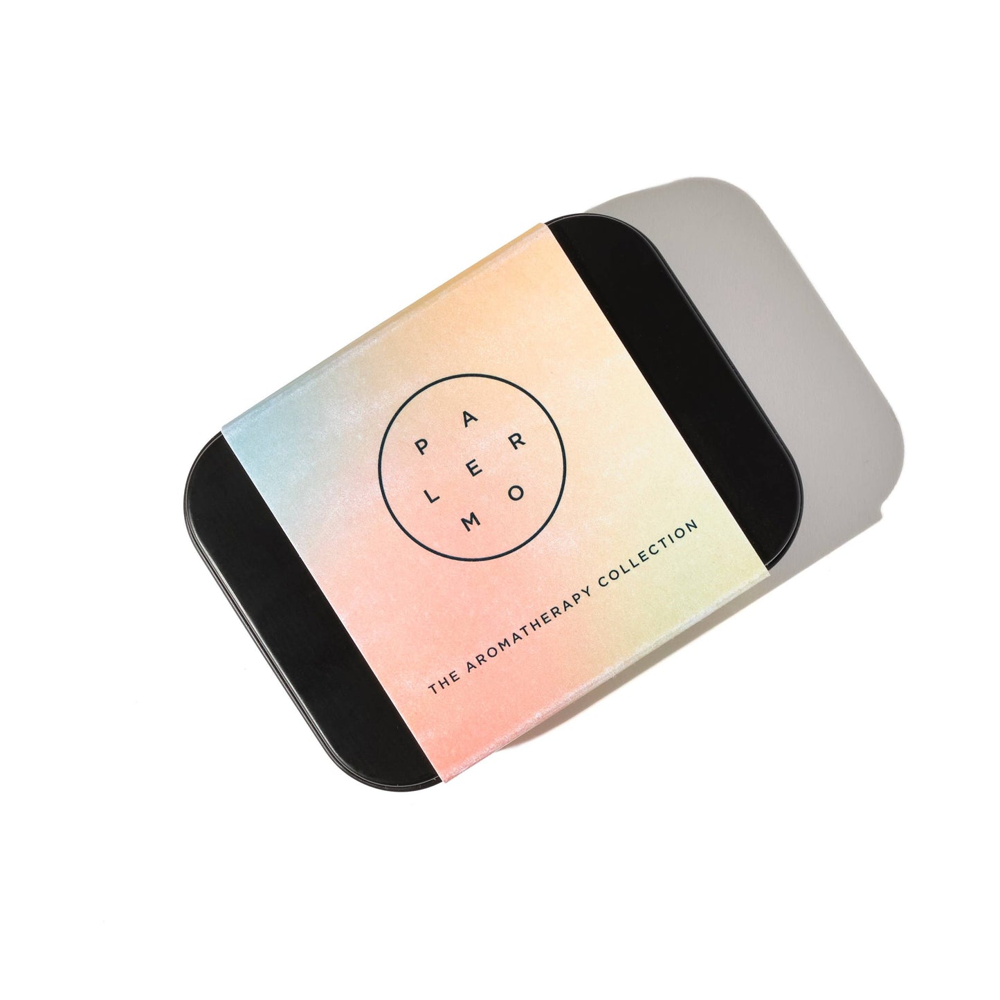 Gradient-colored container with 'Palermo body' branding for the aromatherapy collection, on a white background