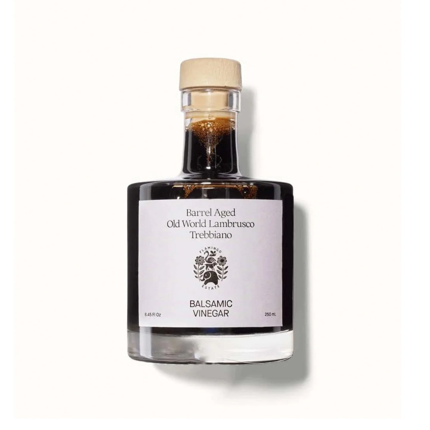 Bottle of balsamic vinegar with a Flamingo Estate label on a white background
