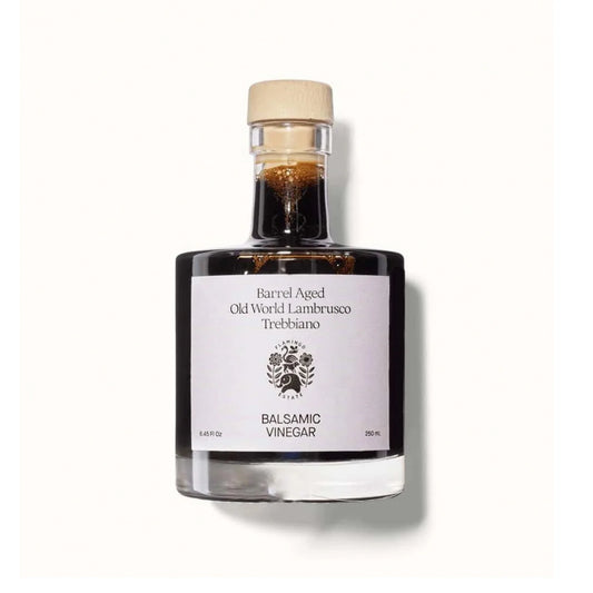 Bottle of balsamic vinegar with a Flamingo Estate label on a white background