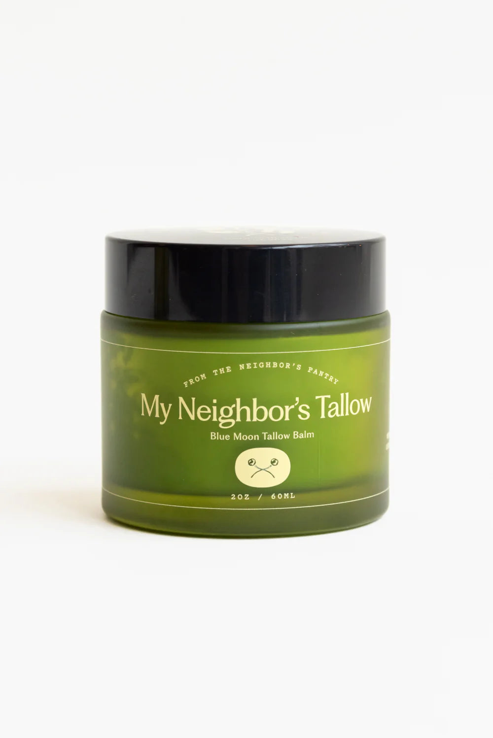 Green jar of 'My Neighbor's Tallow' Blue Moon Tallow balm on a white background