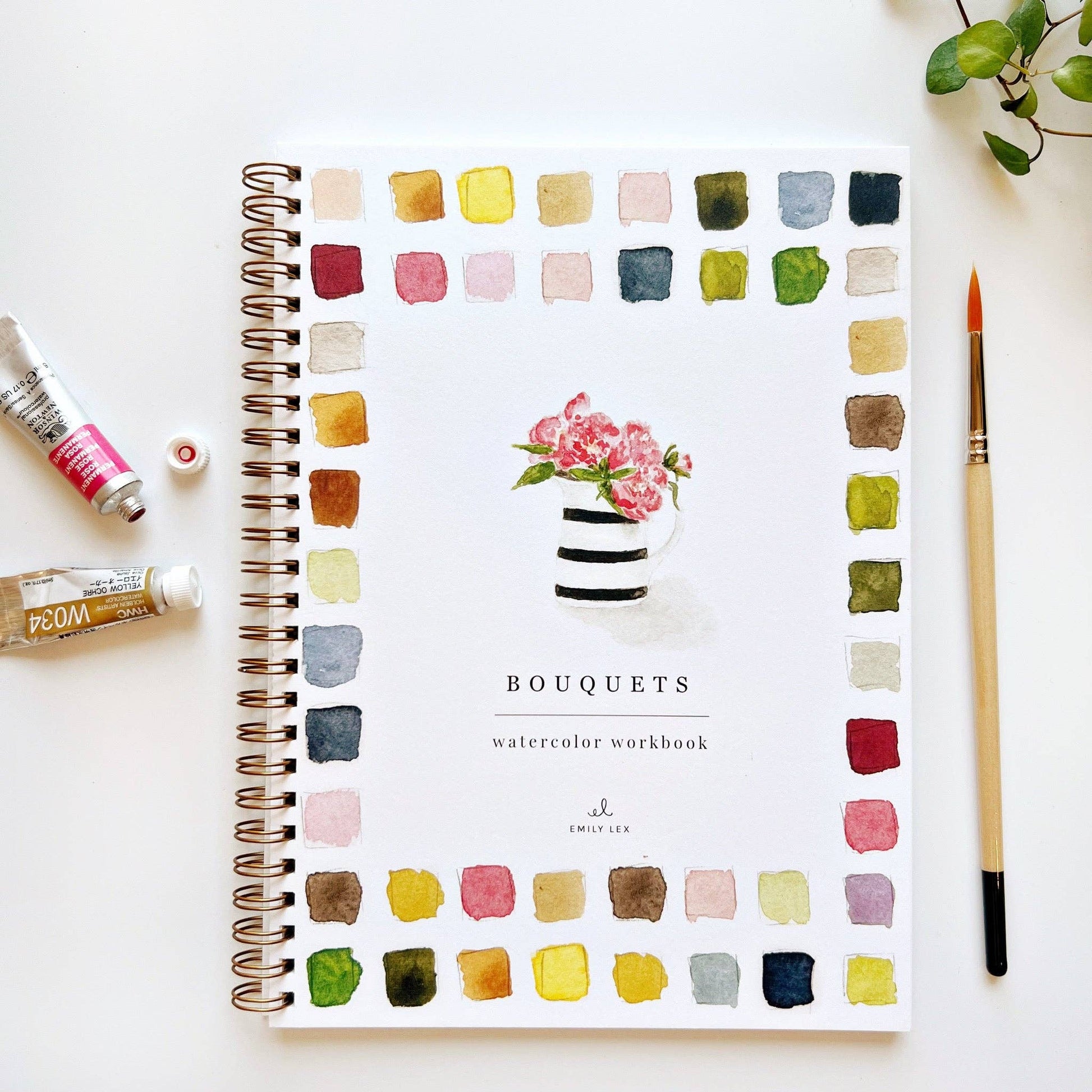 Watercolor workbook titled 'Bouquets' with a flower bouquet illustration, color swatches and a paintbrush on a white background