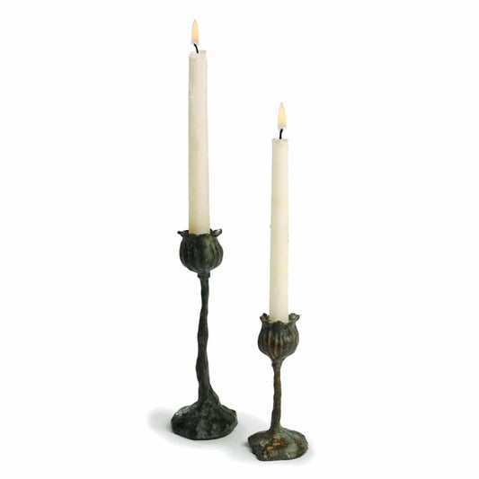 Bronze candlesticks inspired by the graceful form of flower seed pods, in two sizes on a white background.