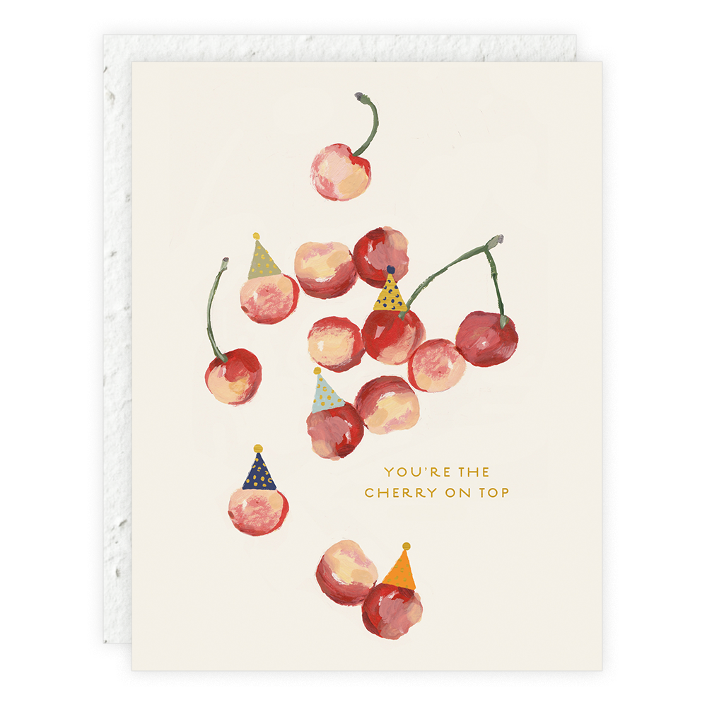 A greeting card with an illustration of cherries wearing party hats, with a text that reads 'You're the cherry on top'.