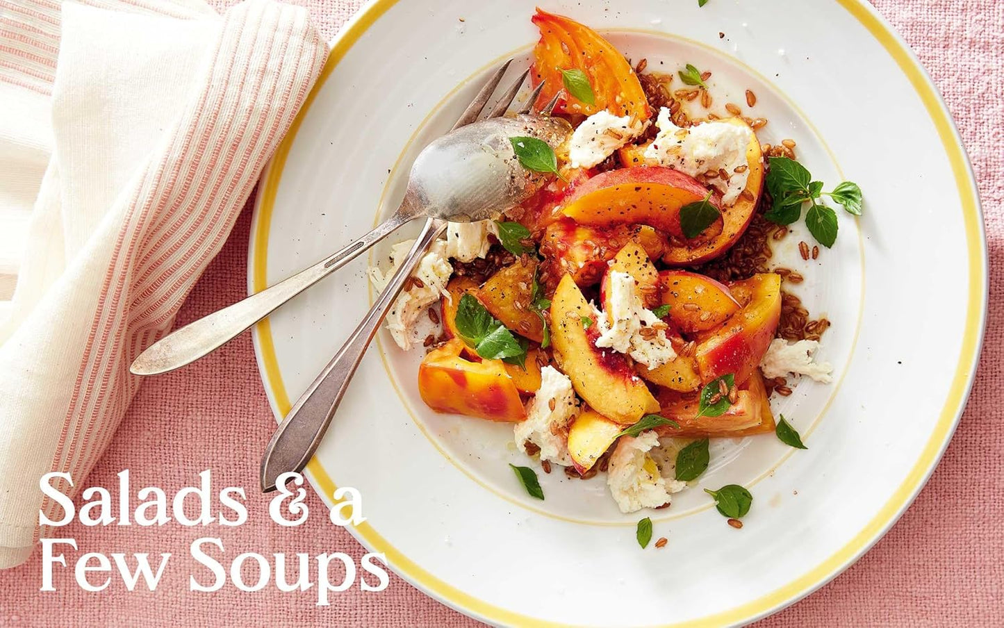 Pages inside the 'Cooking in Real life' cookbook by Lidey Heuck: Plate of salad with peaches and feta cheese on a pink tablecloth, with text 'Salads & a Few Soups'.