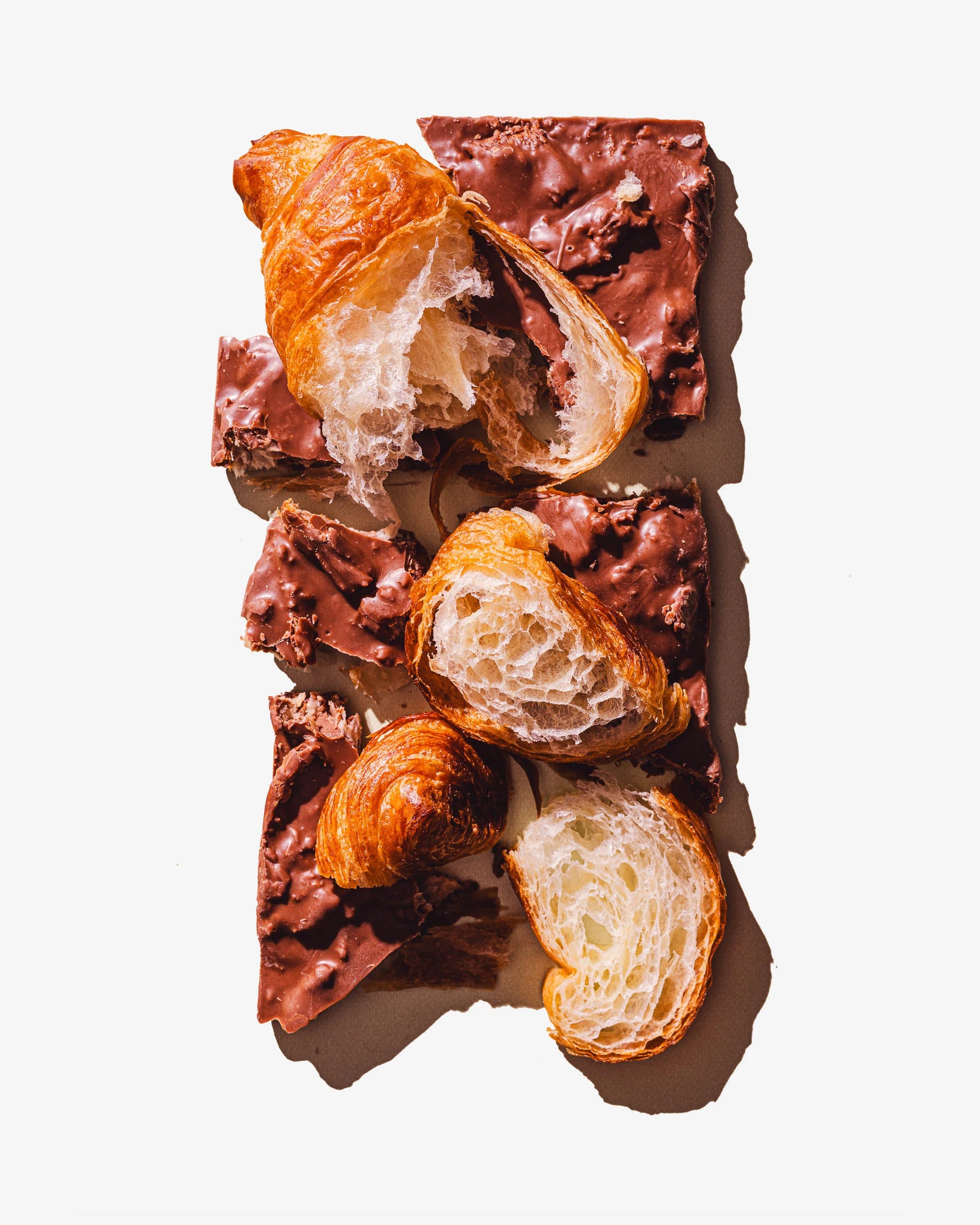 Chunks of the Croissant Chocolate bar from Compartes chocolate, with chunks of real fresh croissants.