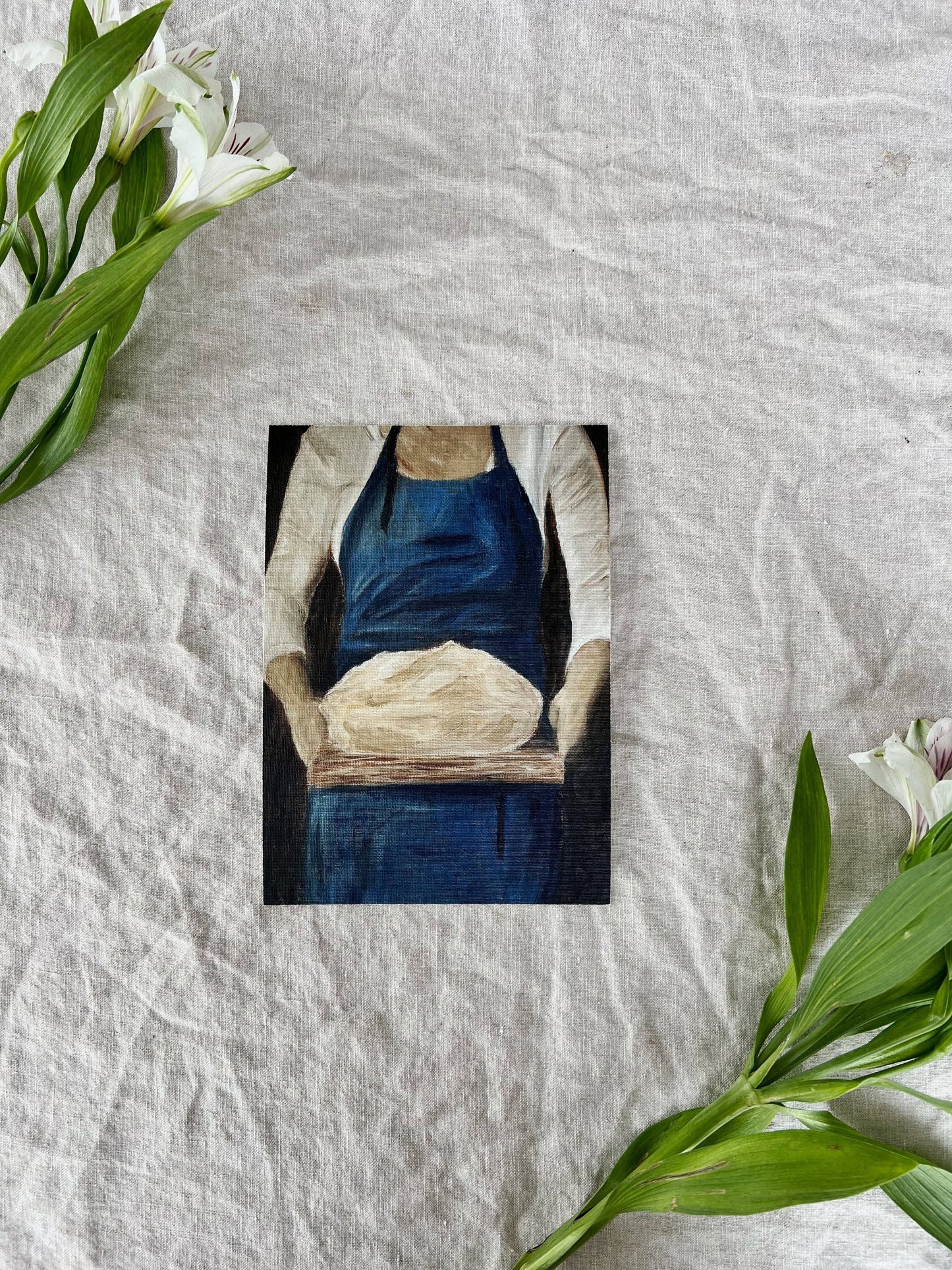 French-inspired art print of a woman holding sourdough bread, unframed.