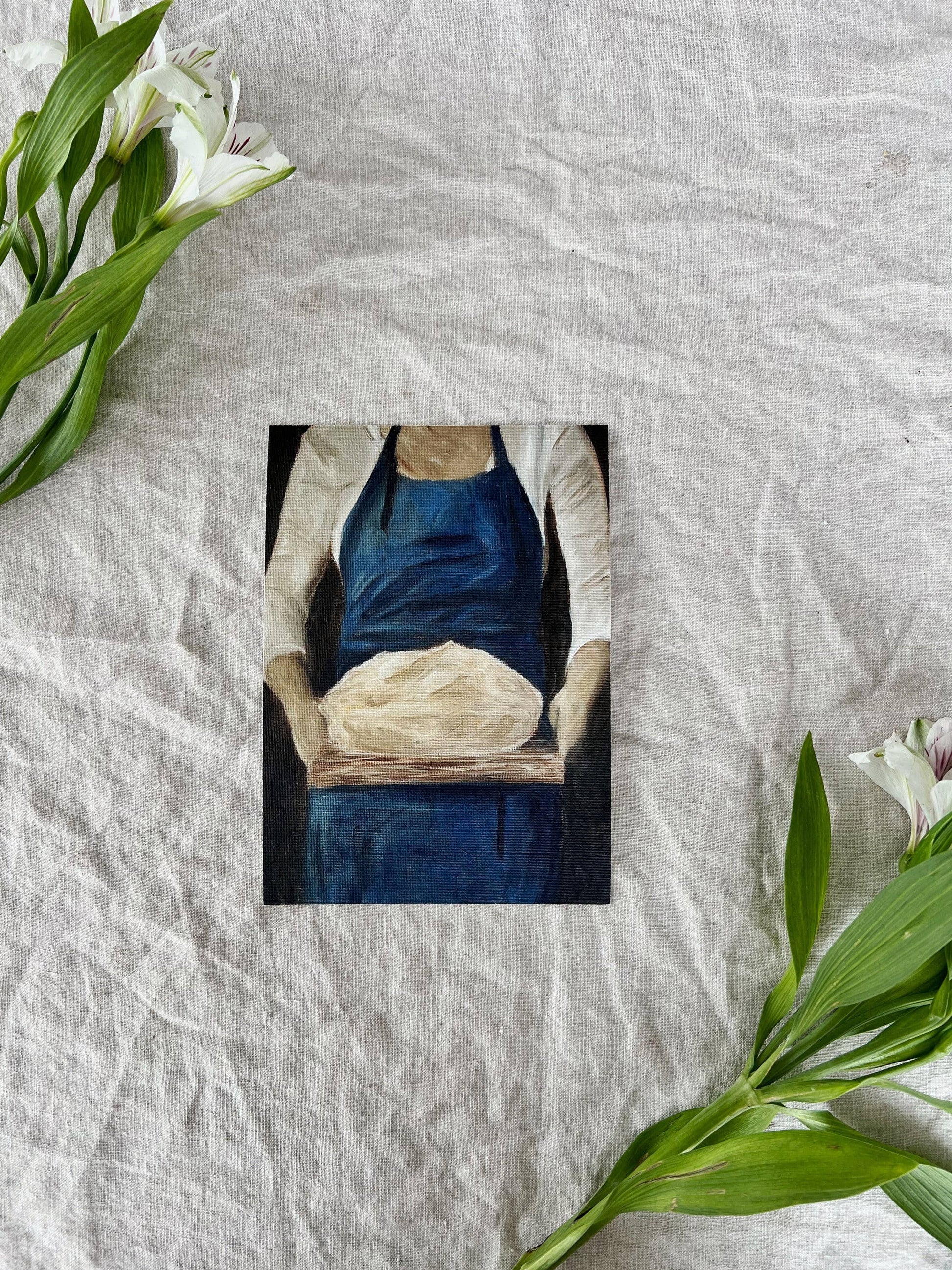 French-inspired art print of a woman holding sourdough bread, unframed.