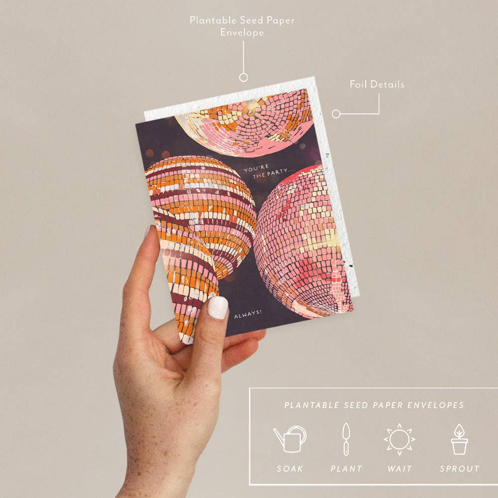 Hand holding a colorful card with eco-friendly plantable seed paper envelope features.