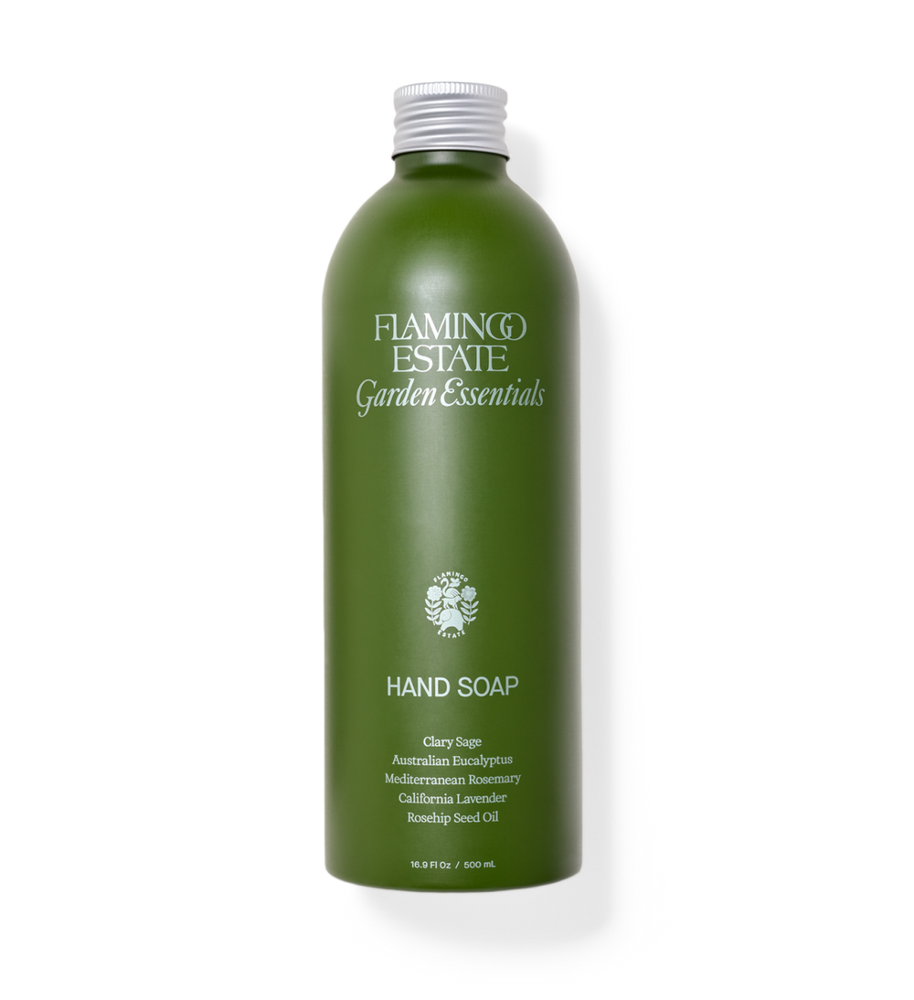 Green bottle of Flamingo Estate Garden Essentials Hand Soap on a white background
