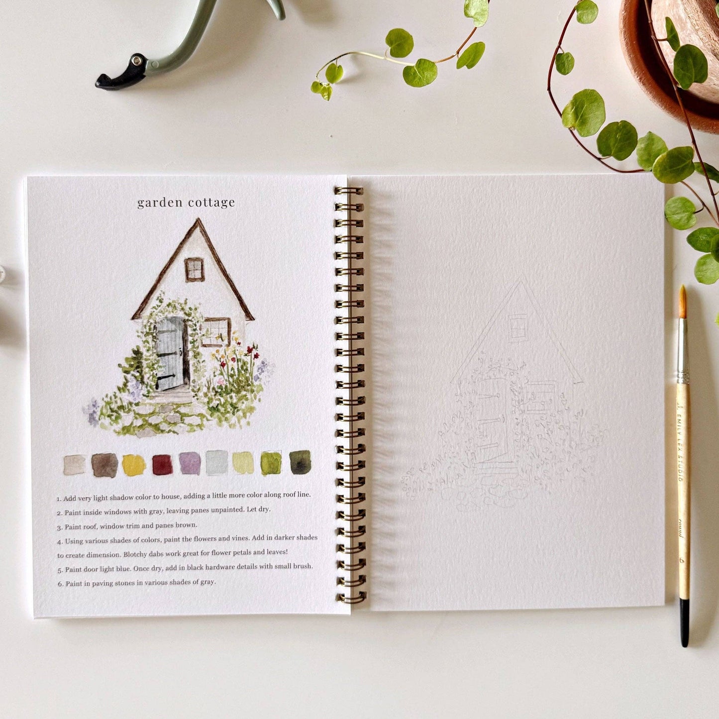 Creative watercolor activity book with step-by-step garden sketches, here on the garden cottage page