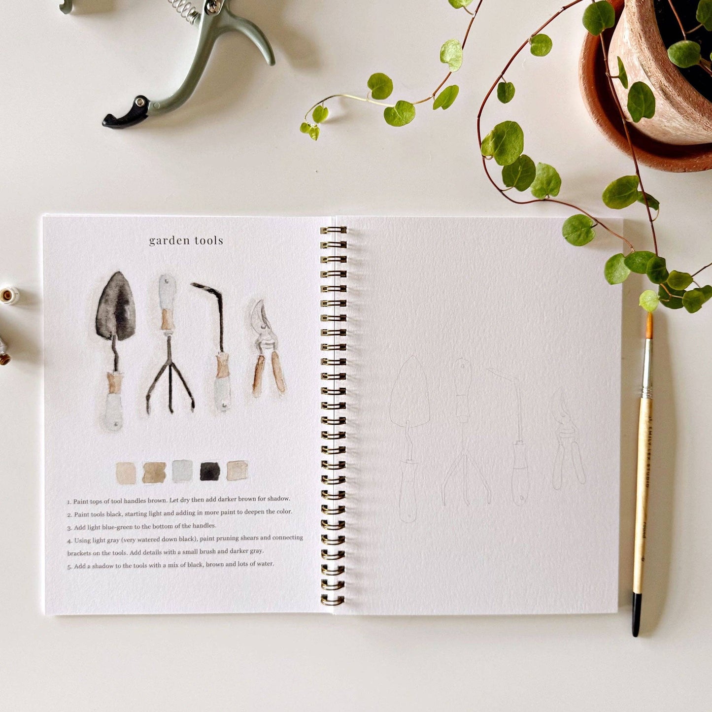 Creative watercolor activity book with step-by-step garden sketches, here on the garden tools page