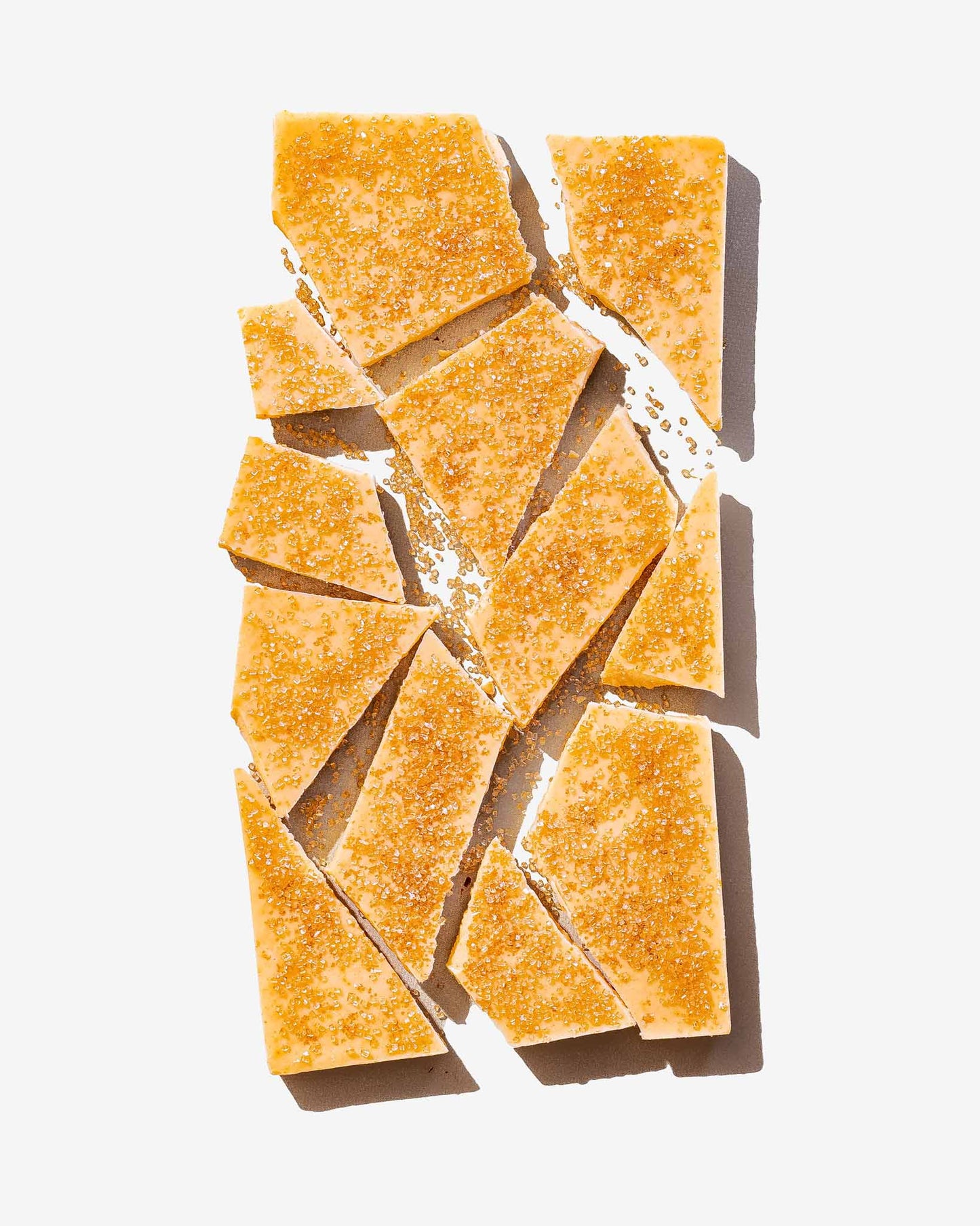 Gourmet Creme Brulee Chocolate Bar from Compartes broken into chunks with caramelized brown sugar