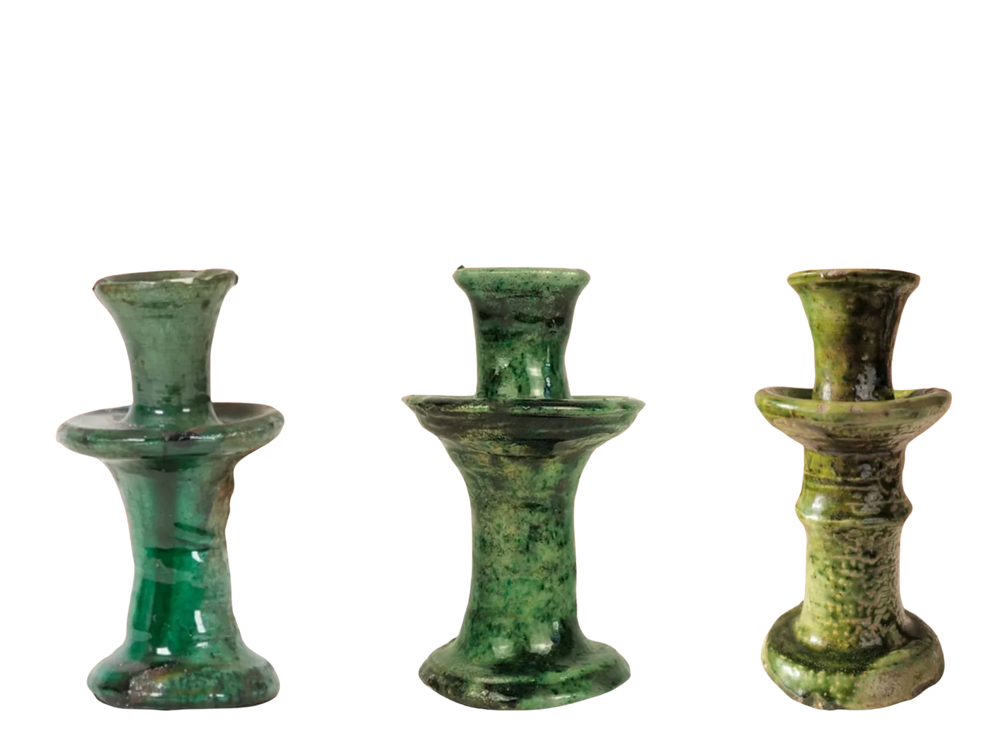 Three green tamegroute ceramic candle holders on a white background