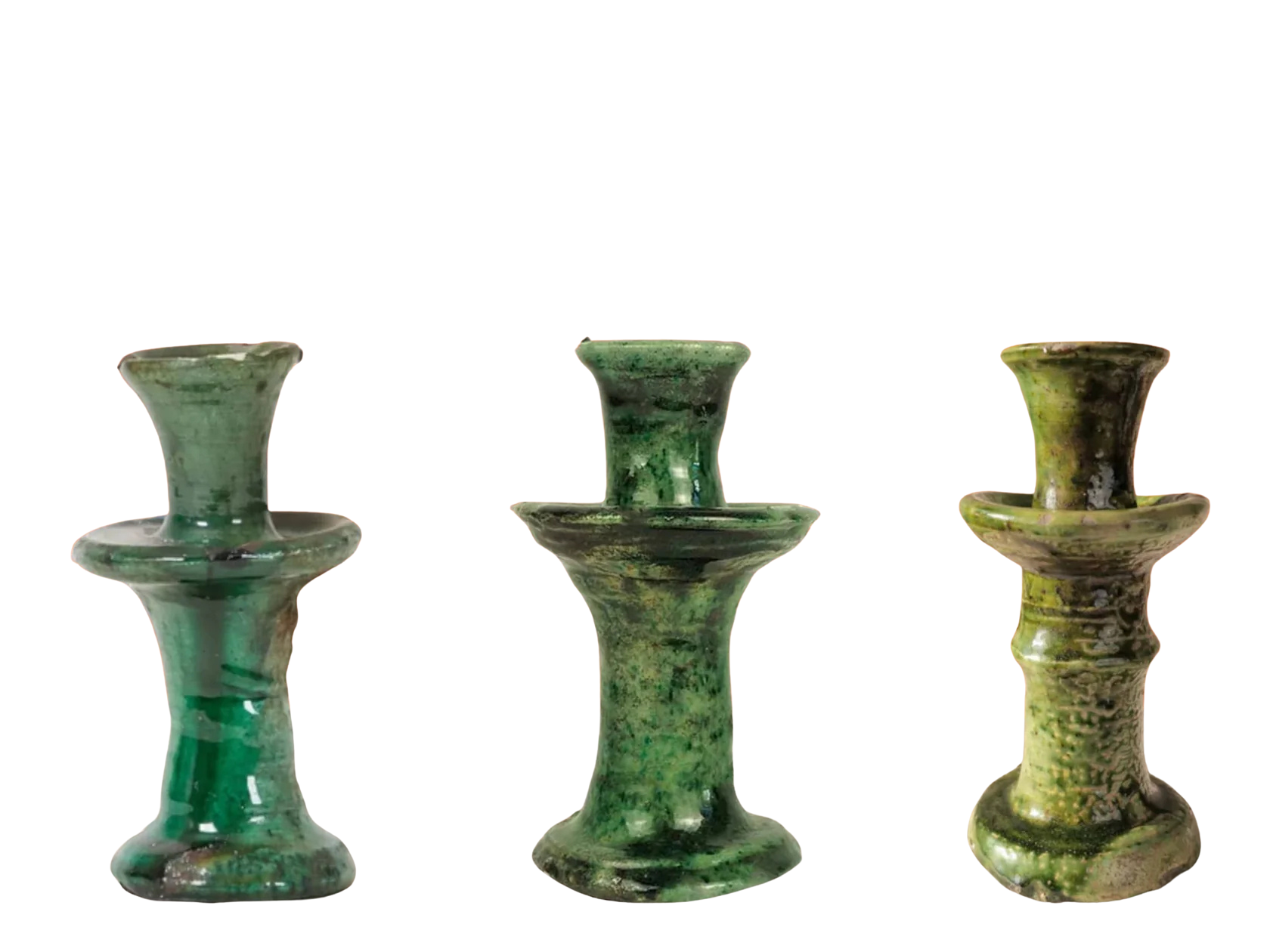 Three green tamegroute ceramic candle holders on a white background