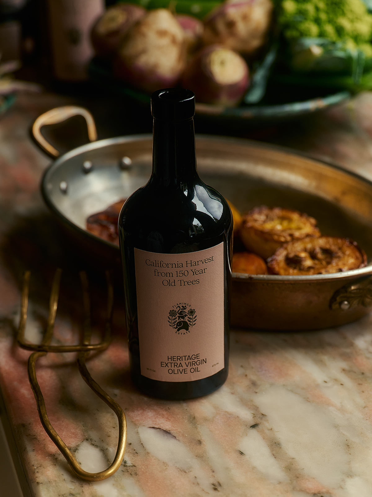 Luxury olive oil bottle with luminous green hue, from Flamingo Estate.
