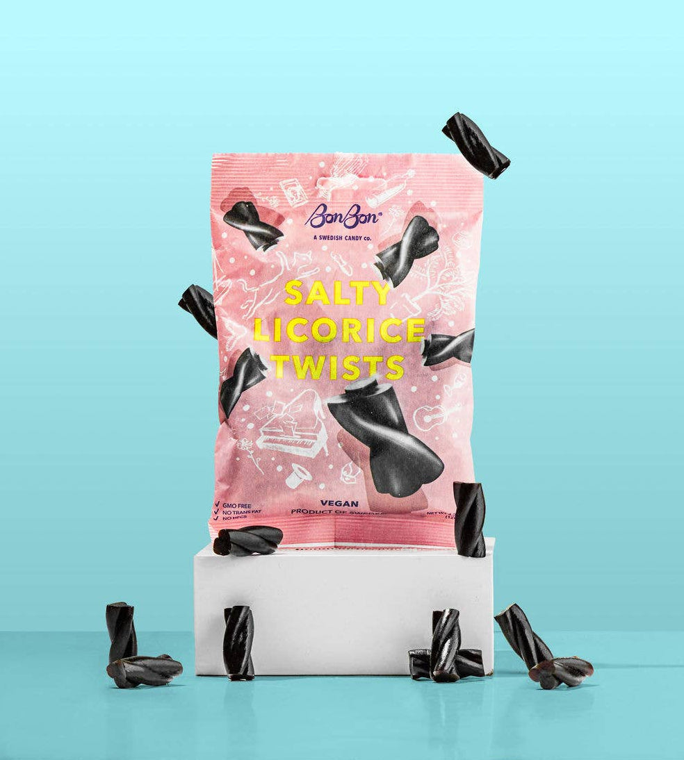 Packaging of Salty Licorice Twists, vegan salty and sweet candies, with black licorice twists on a light blue background