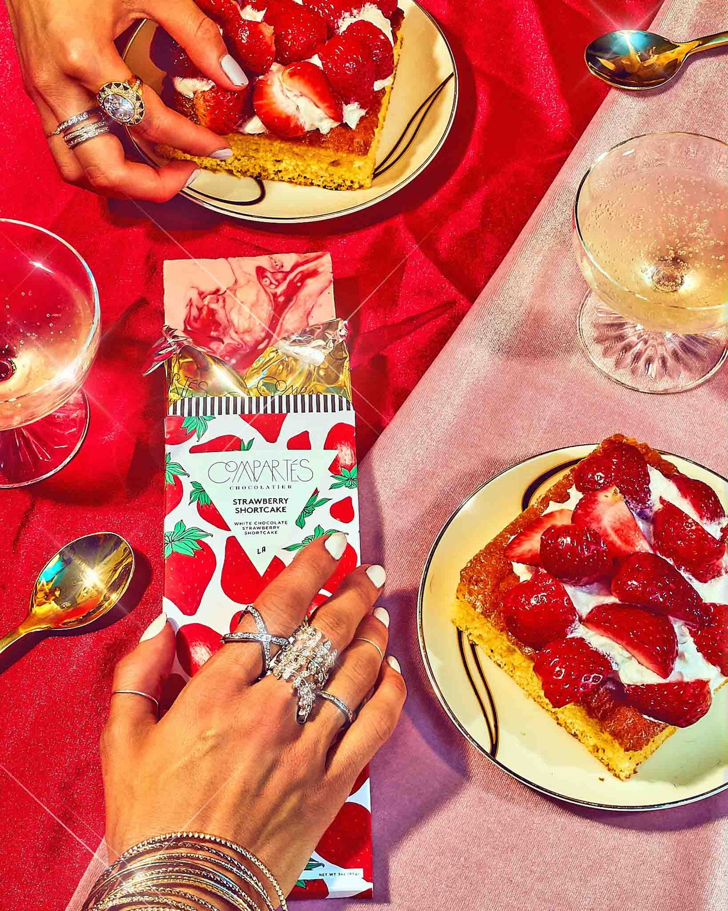 Strawberry shortcake white chocolate with strawberry cakes on a red tablecloth.