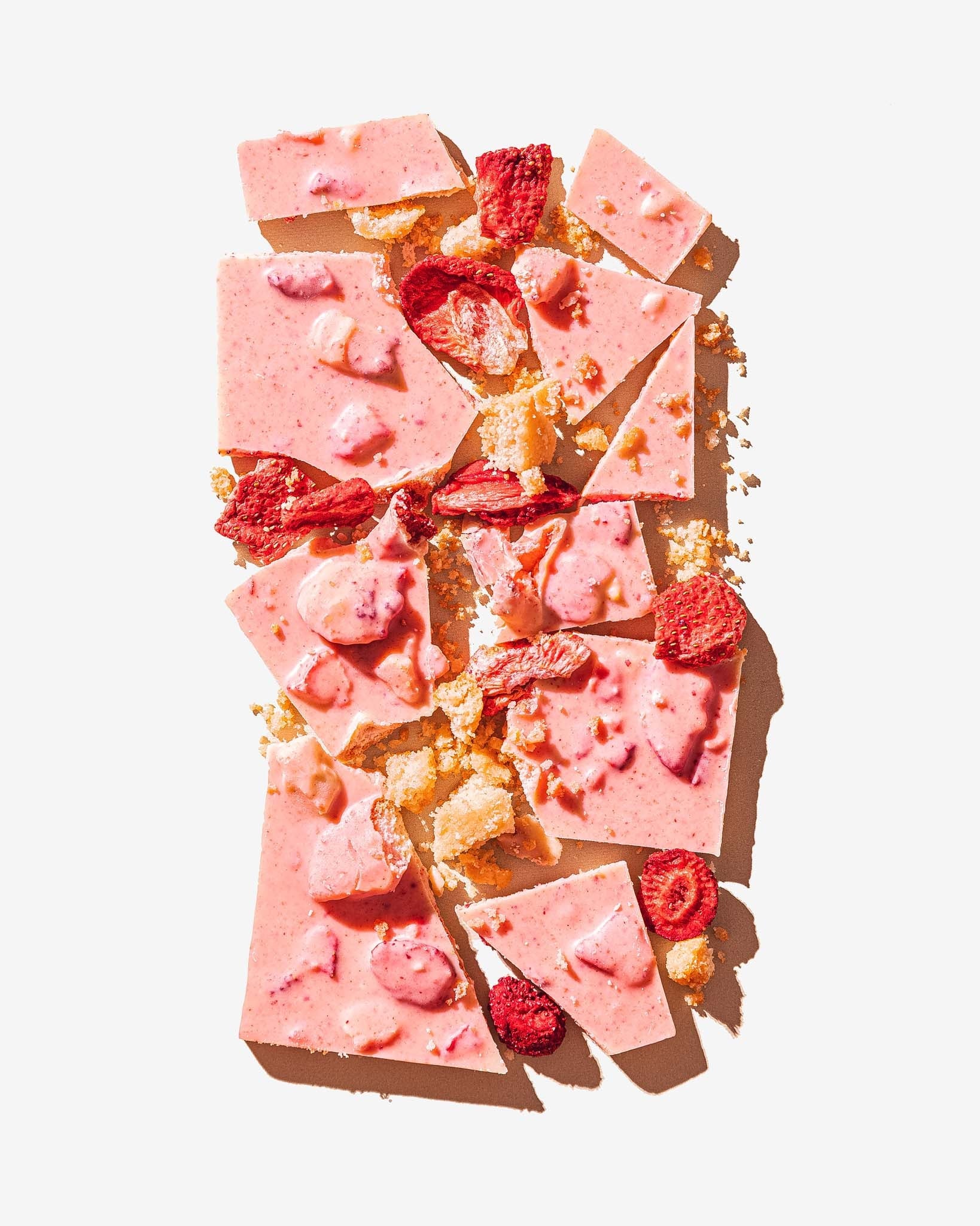 Chunks of Compartes Strawberry Shortcake Chocolate Bar with strawberries and shortcake pieces