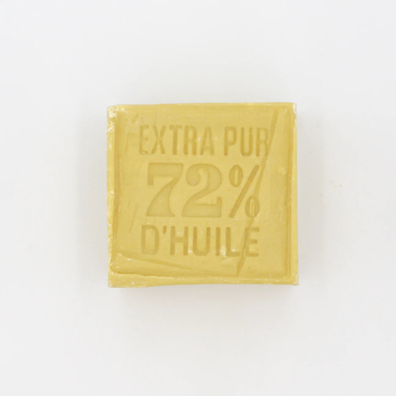 Yellow bar of Marseille soap with text on a white background
