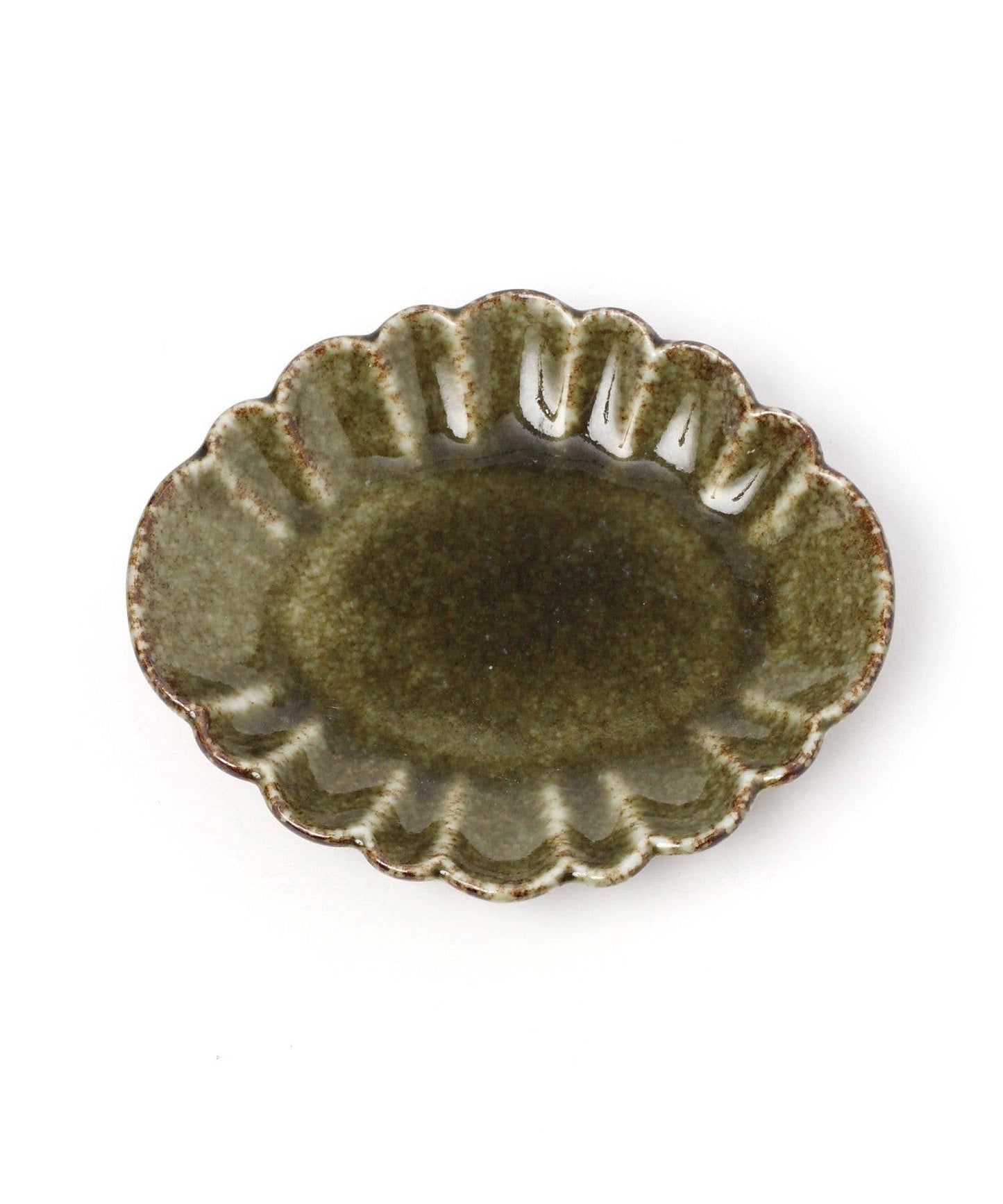 A mini oval chrysanthemum-shaped ceramic plate with a green tint and floral detailing on the rim.