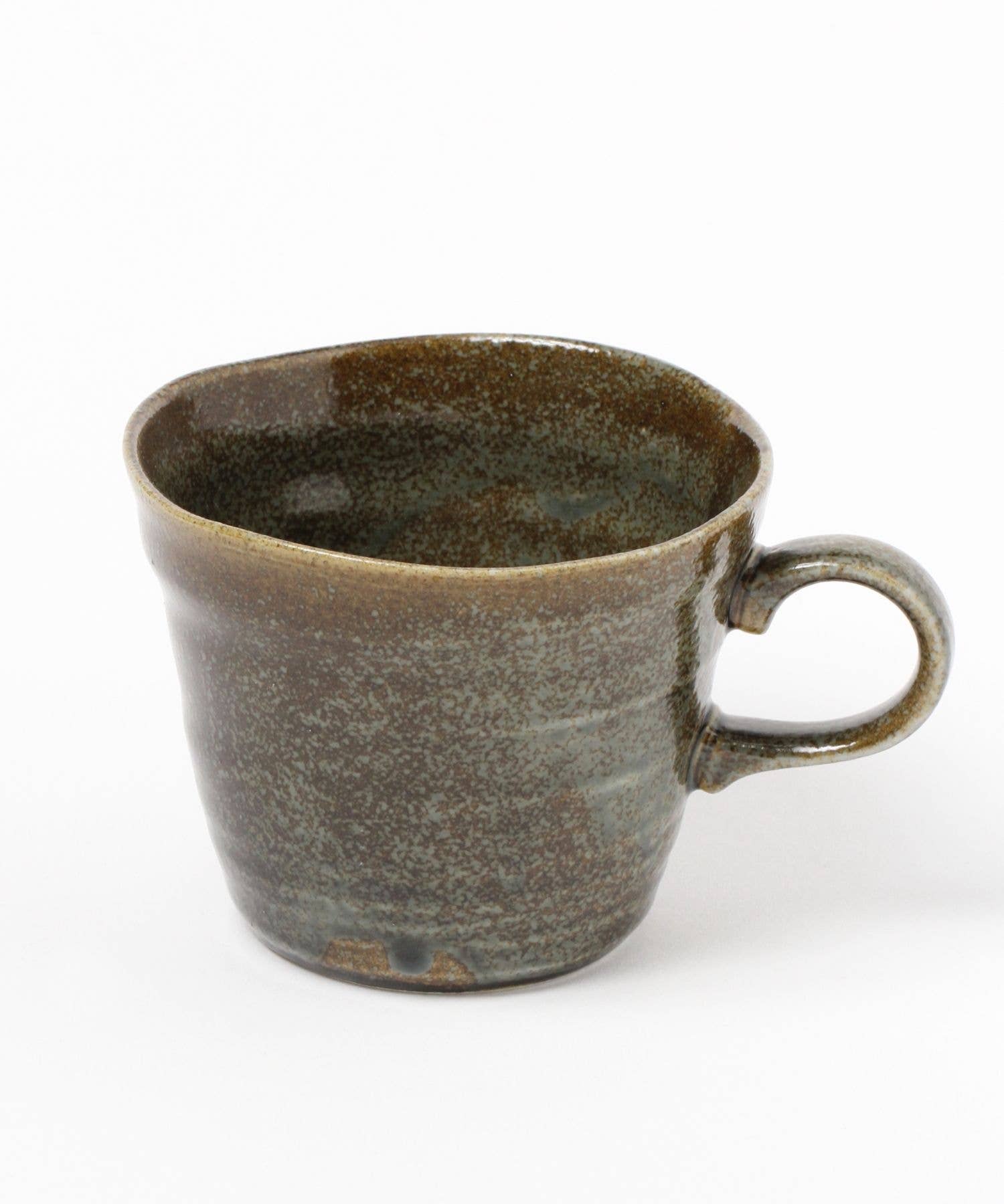 A moss green ceramic mino ware mug with an organic shape on a white background.