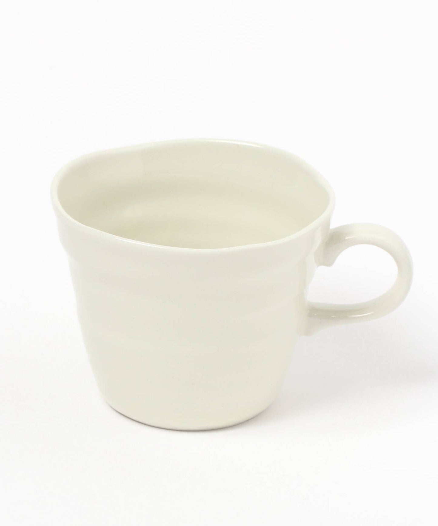 A gloss white ceramic mino ware mug with an organic shape on a white background.