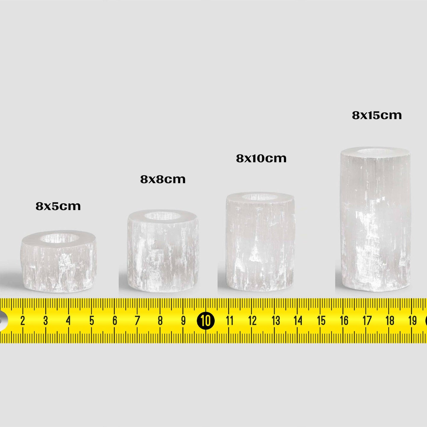Four handmade moroccan selenite crystal candle holders, with four different sizes and their dimensions in cm.