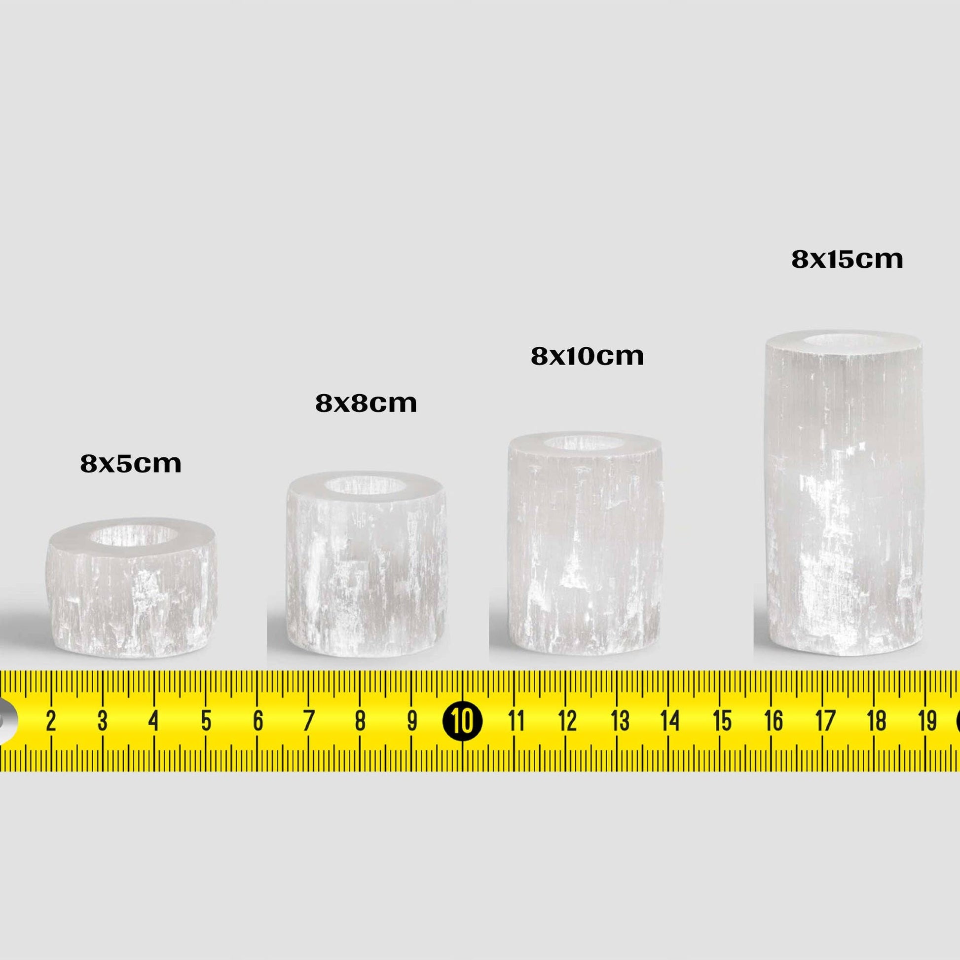 Four handmade moroccan selenite crystal candle holders, with four different sizes and their dimensions in cm.