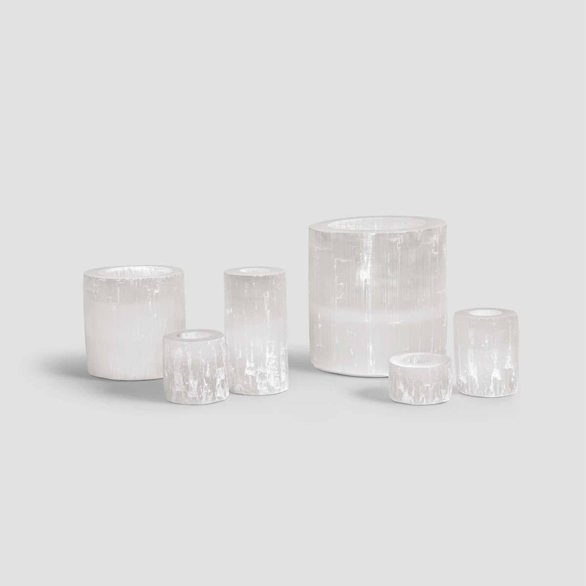 Six handmade moroccan selenite crystal candle holders, with six different sizes, two of them being really big.