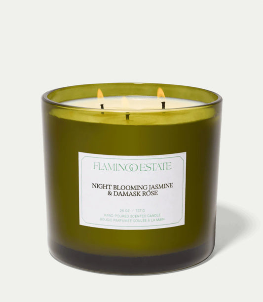 Green Flamingo Estate candle with a label on a white background