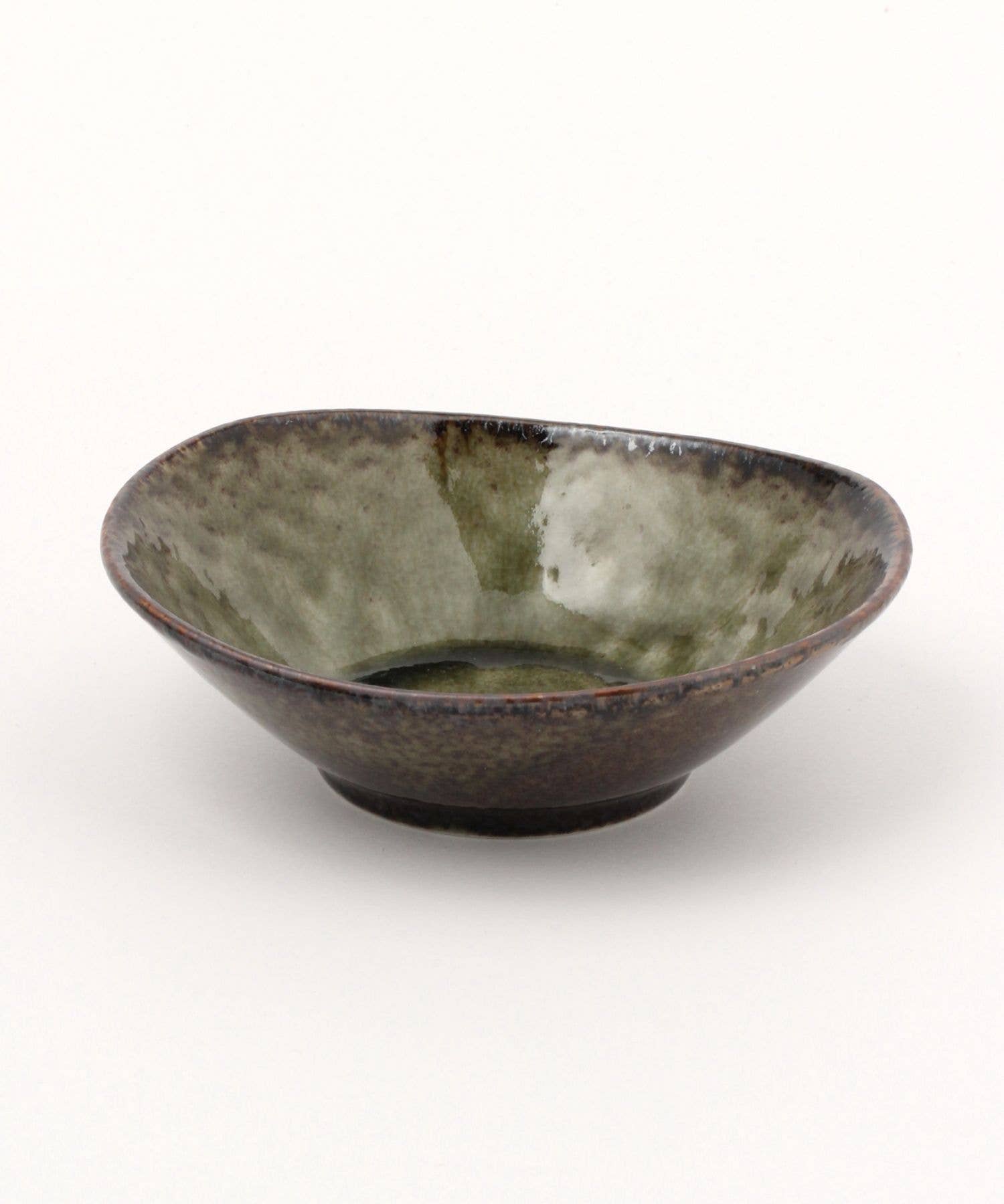 A moss green ceramic mino ware mini bowl with an organic shape on a white background.