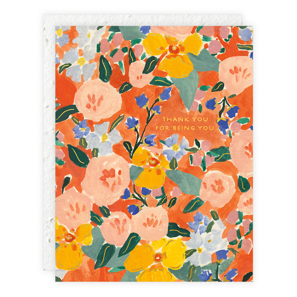 A floral patterned thank you card with orange, red, and yellow flowers and green leaves, with a thank you message in the center.