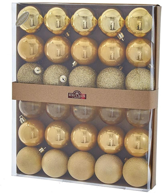 Set of gold Christmas ornaments in a decorative box with Kurt S. Adler branding.