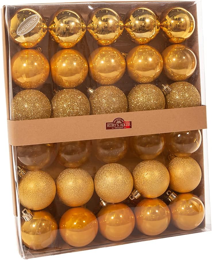 Box of gold Christmas ornaments with a visible Kurt S. Adler brand label.
