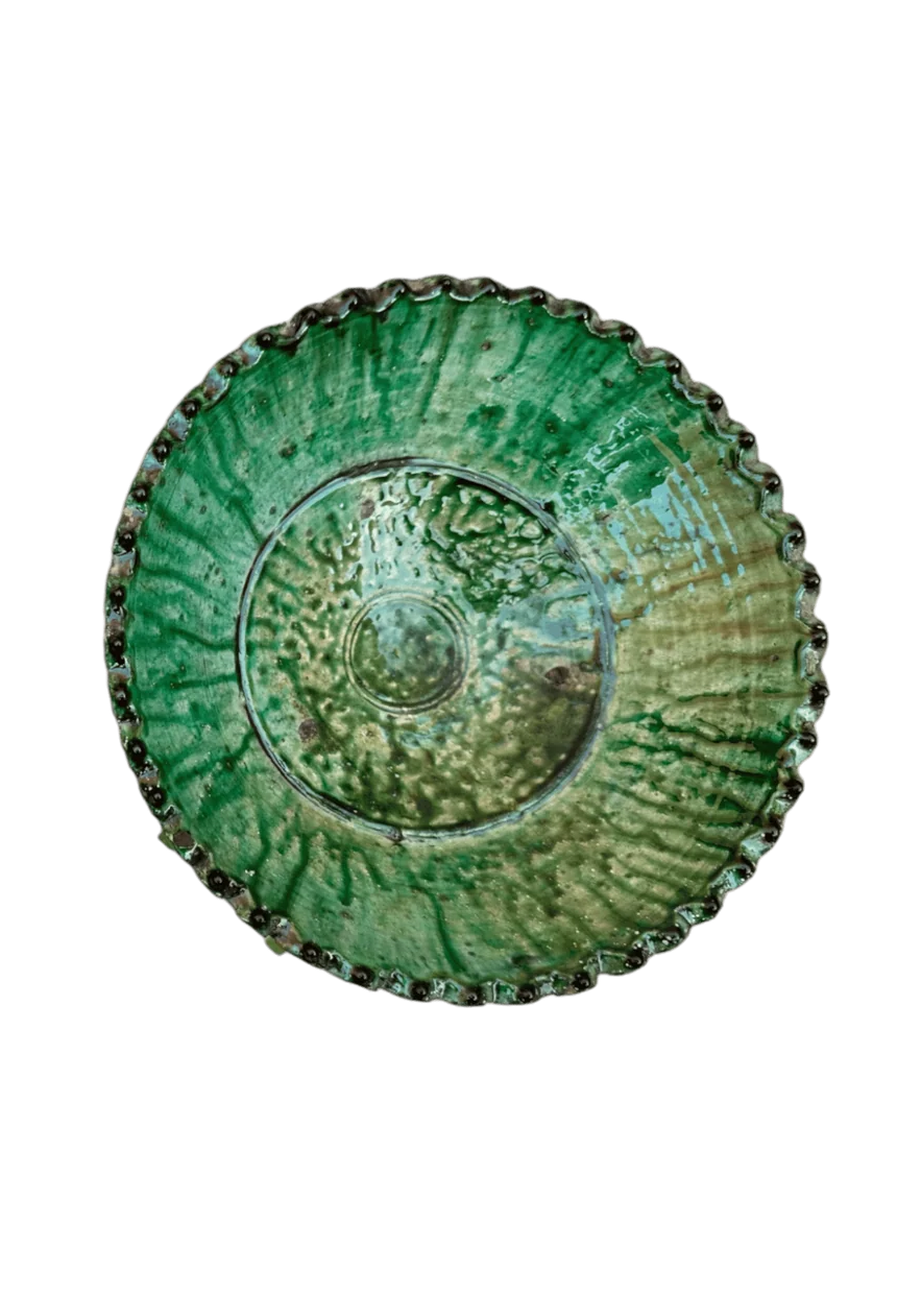 A ceramic fruit bowl or planter, with green glaze, handmade in Tamegroute, Morocco, viewed from the top.