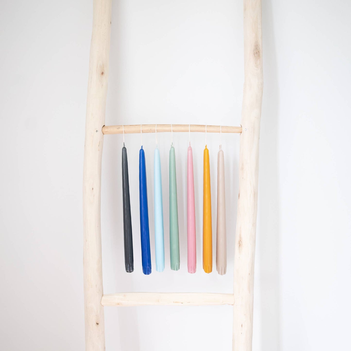 Taper candles in various colors.