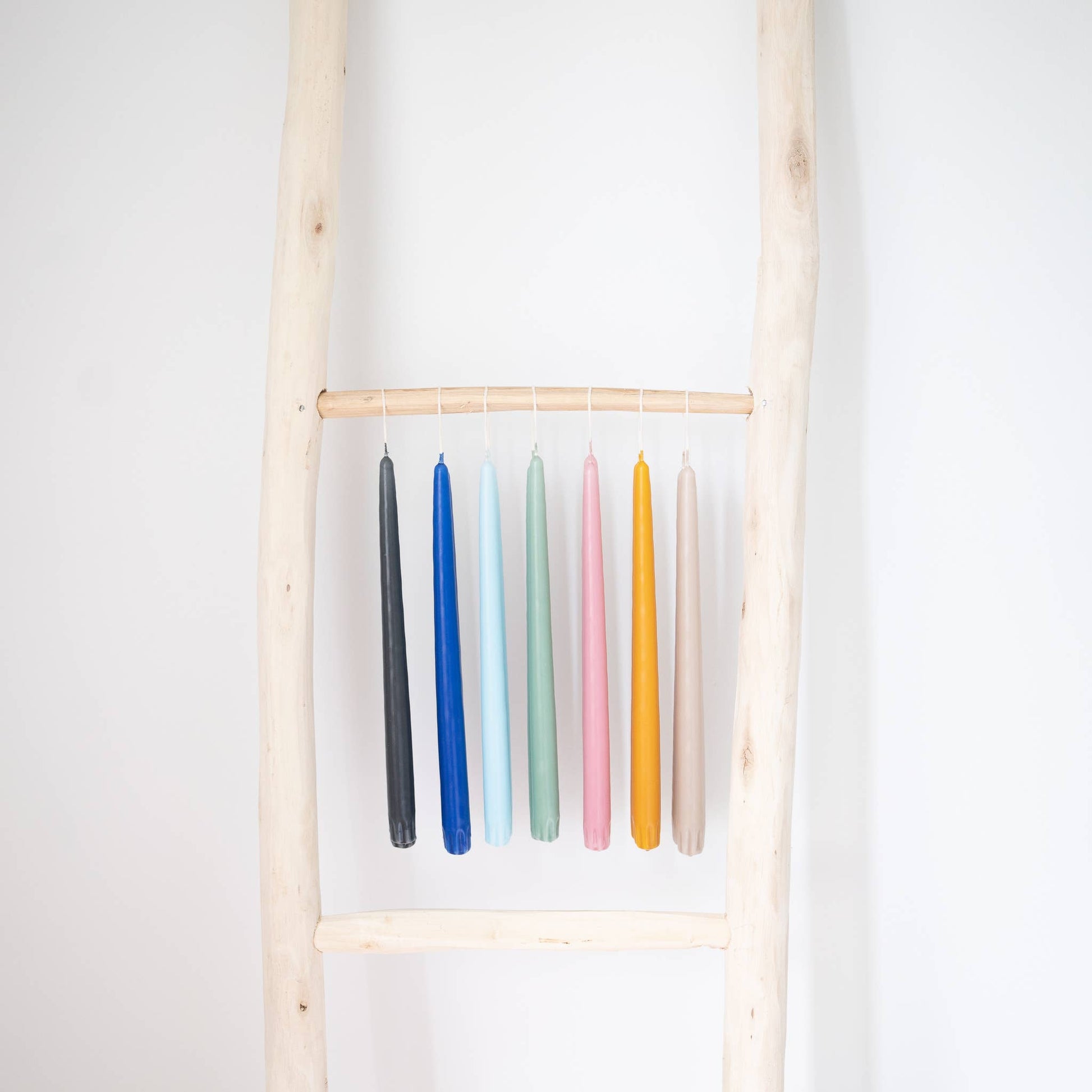 Taper candles in various colors.
