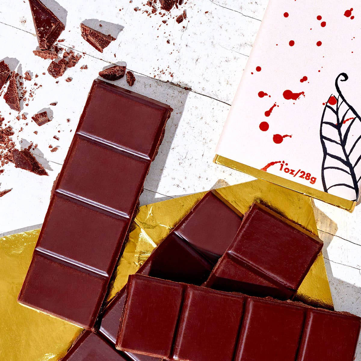 A Valentine's hazelnut butter dark chocolate bar, cut into pieces, from Fine & Raw.