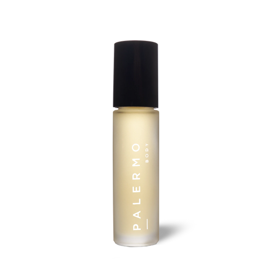 Skincare bottle of aromatherapy roll-on for confidence and creativity with black cap and 'Palermo' branding on a white background