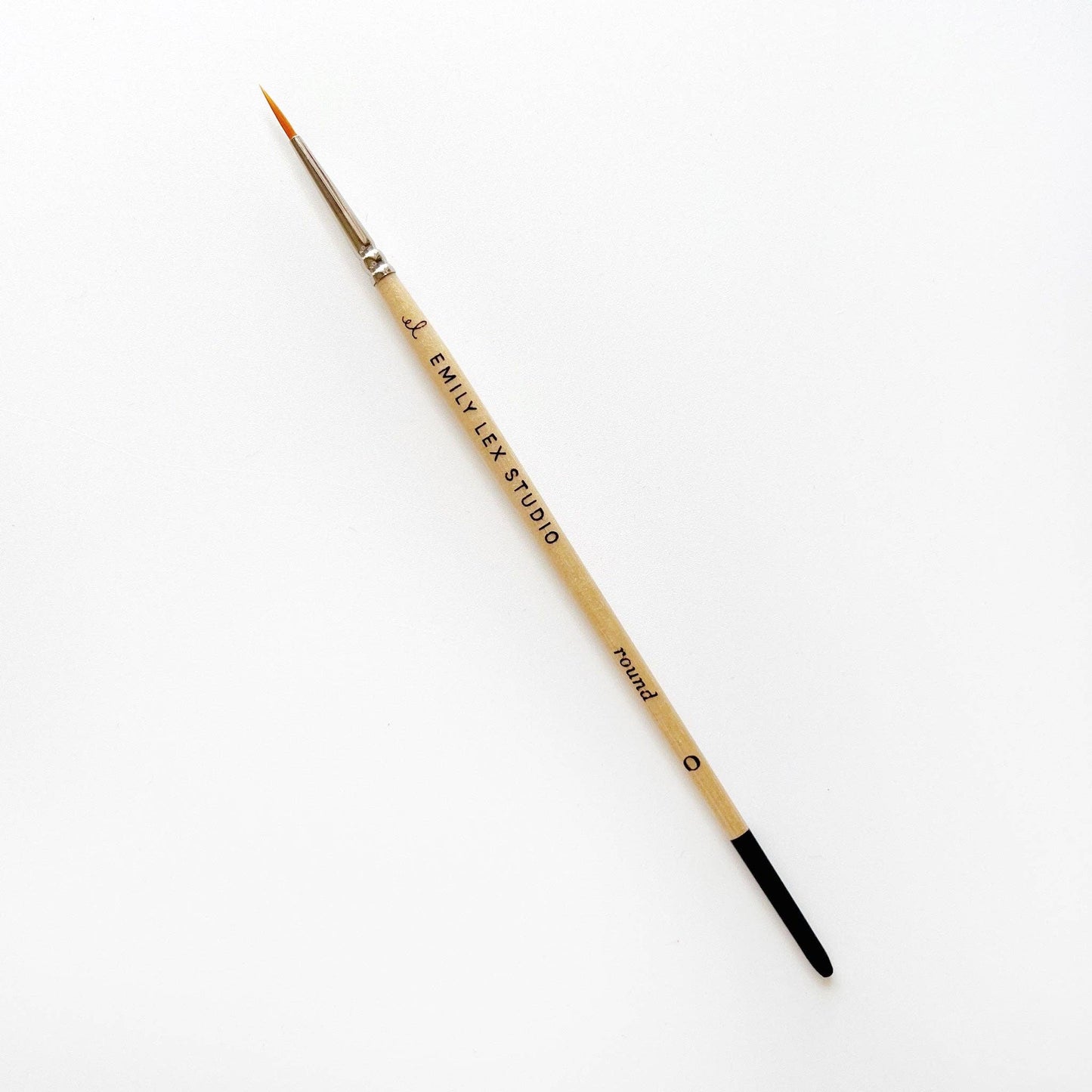 A watercolor paintbrush with golden synthetic taklon bristles, seamless aluminum ferrules, and lacquered wood handles, from emily lex studio, size 0, great for small marks.
