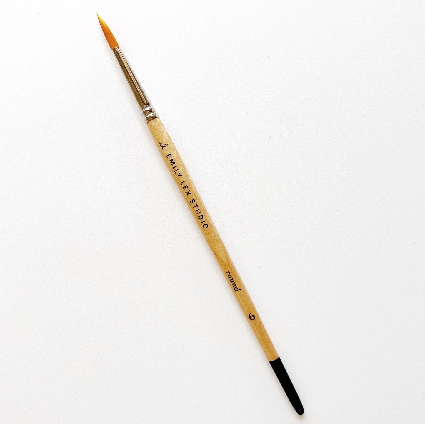 A watercolor paintbrush with golden synthetic taklon bristles, seamless aluminum ferrules, and lacquered wood handles, from emily lex studio, size 6, great for the bulk of the paintings.