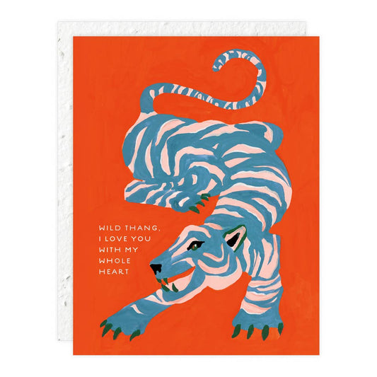 Card with a blue tiger illustration on an orange background and "wild thang" text.